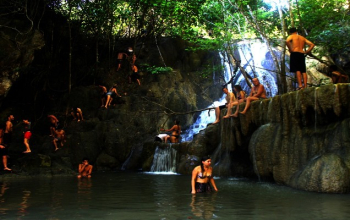 Mata Jitu Waterfall surrounded by tropical forest on Moyo Island