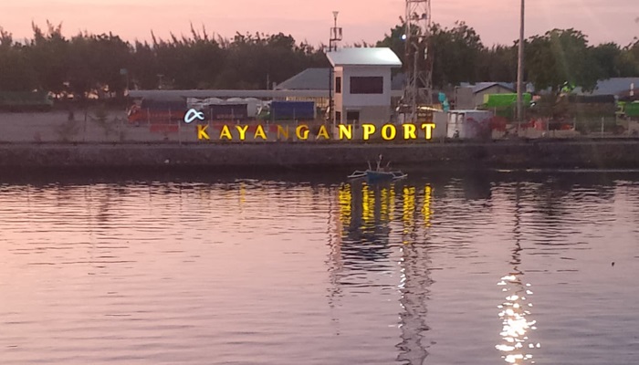 Kayangan Harbor in Lombok with ferries and blue sea, gateway to Labuan Bajo.