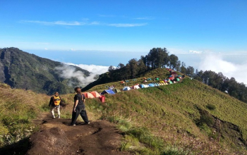 Trekking Mount Rinjani summit in Lombok, Indonesia , breathtaking sunrise view above clouds before sailing to Komodo.